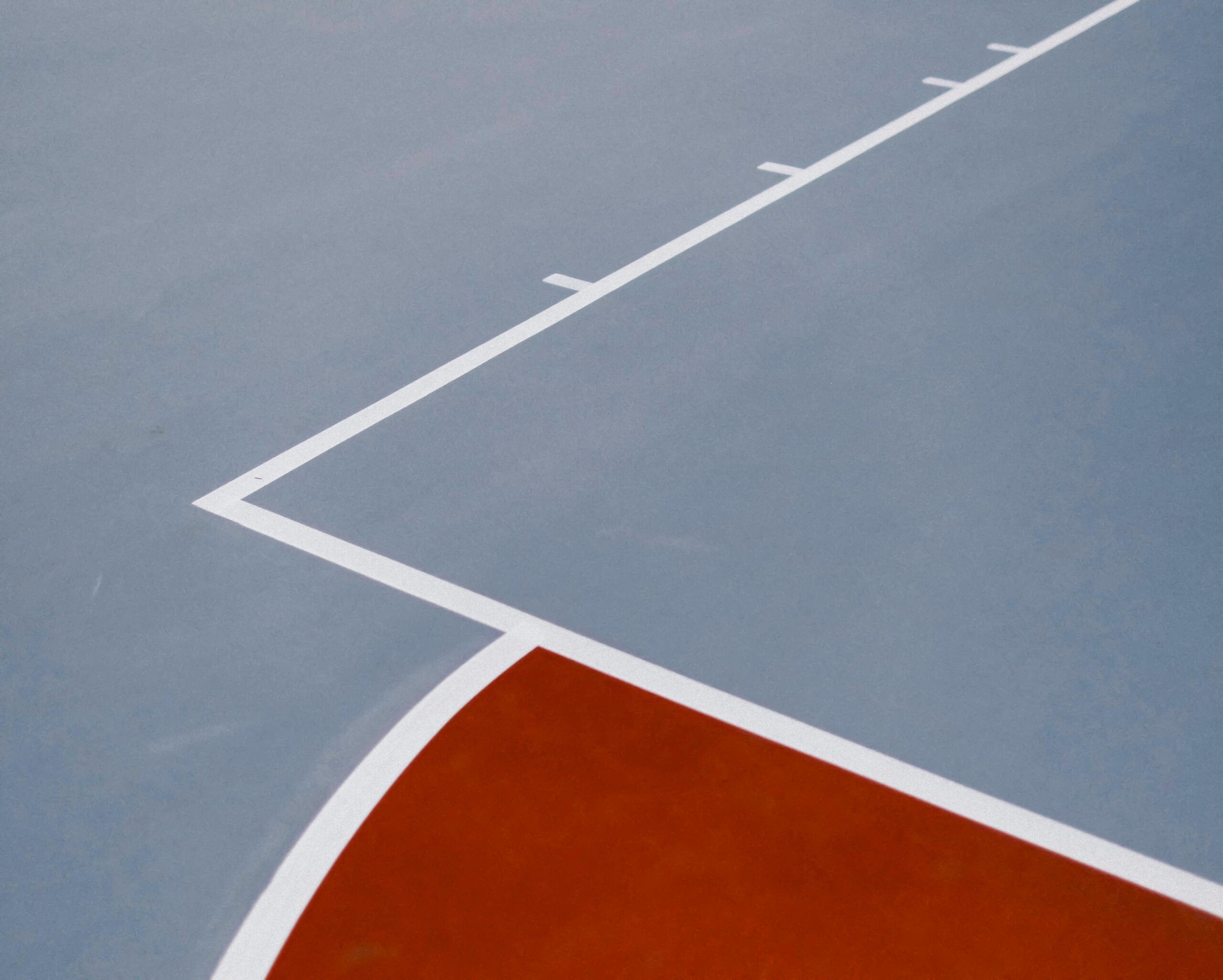 Close-up of FIBA-style court markings on a basketball court